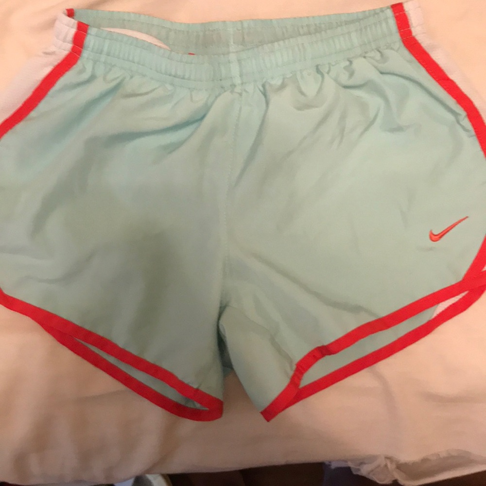 Nike teal and Orangish/reddish shorts